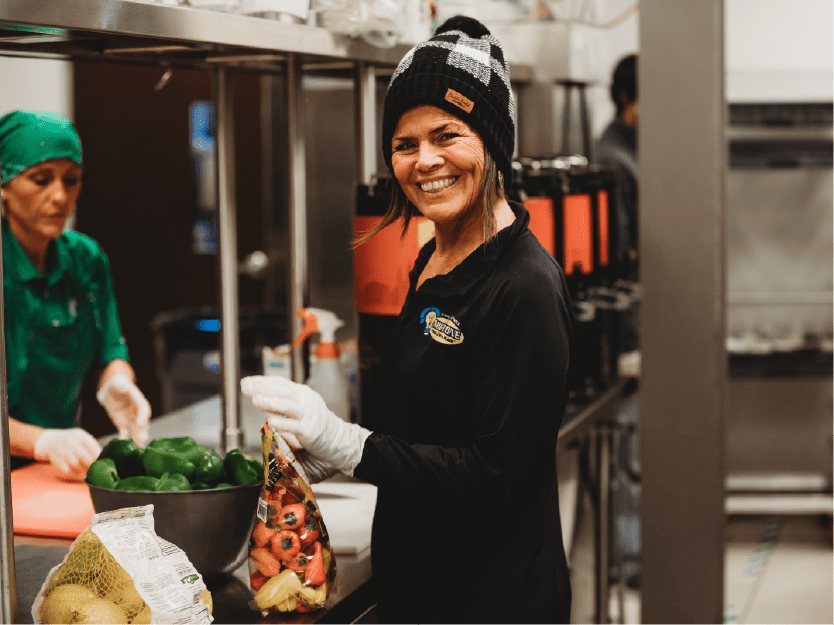 Volunteer serving food at a community event