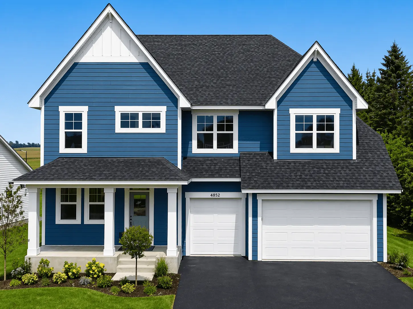 Blue two-story home with new siding