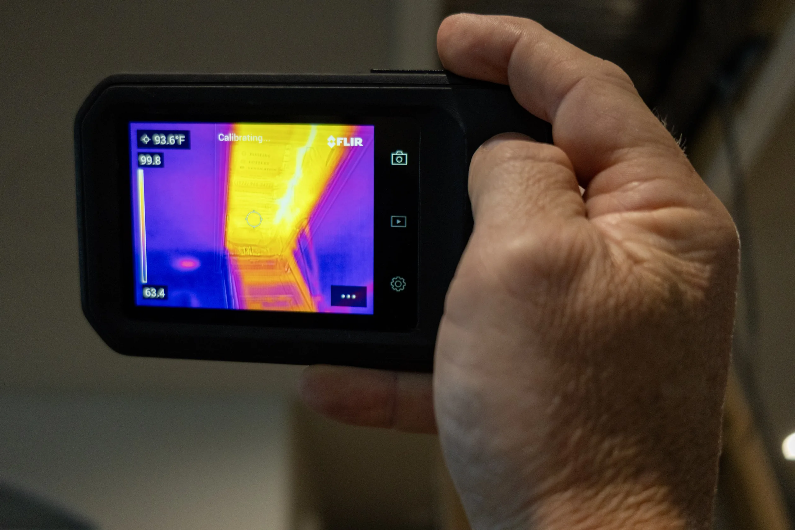 Thermal camera reading during an attic assessment