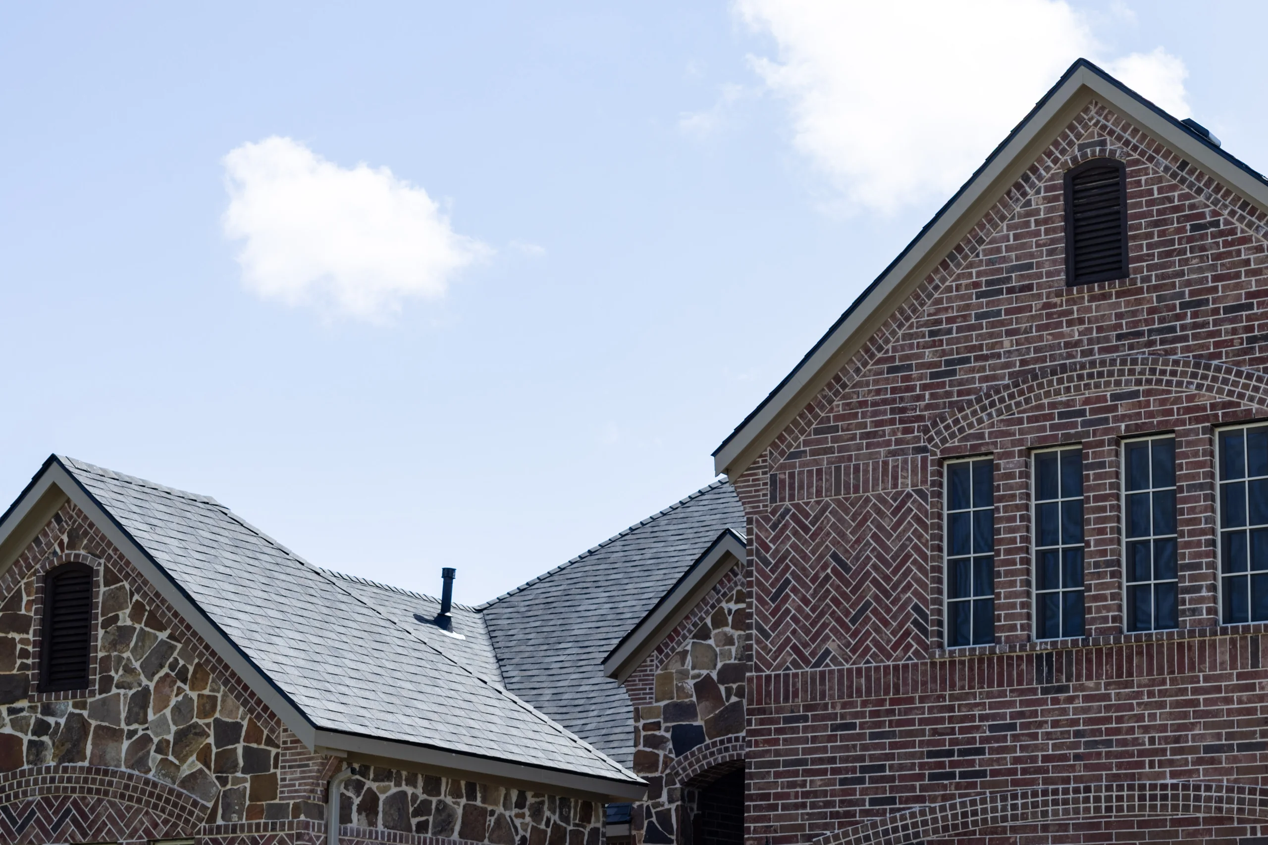 Completed asphalt roof after a Firehouse Roofing project
