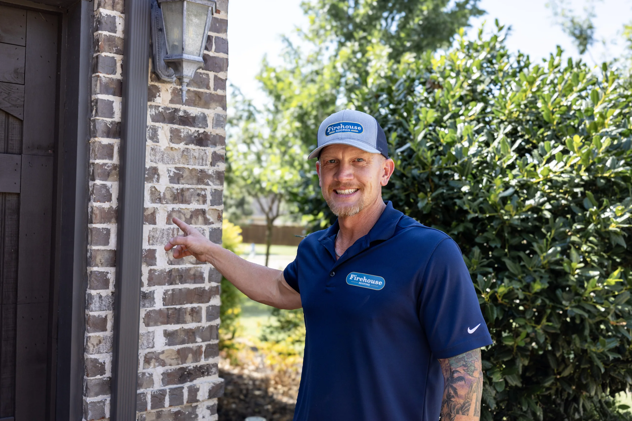 Firehouse Roofing Advisor Inspecting a Chimney and Roof Transition Firehouse Roofing advisor inspecting a chimney and roof transition