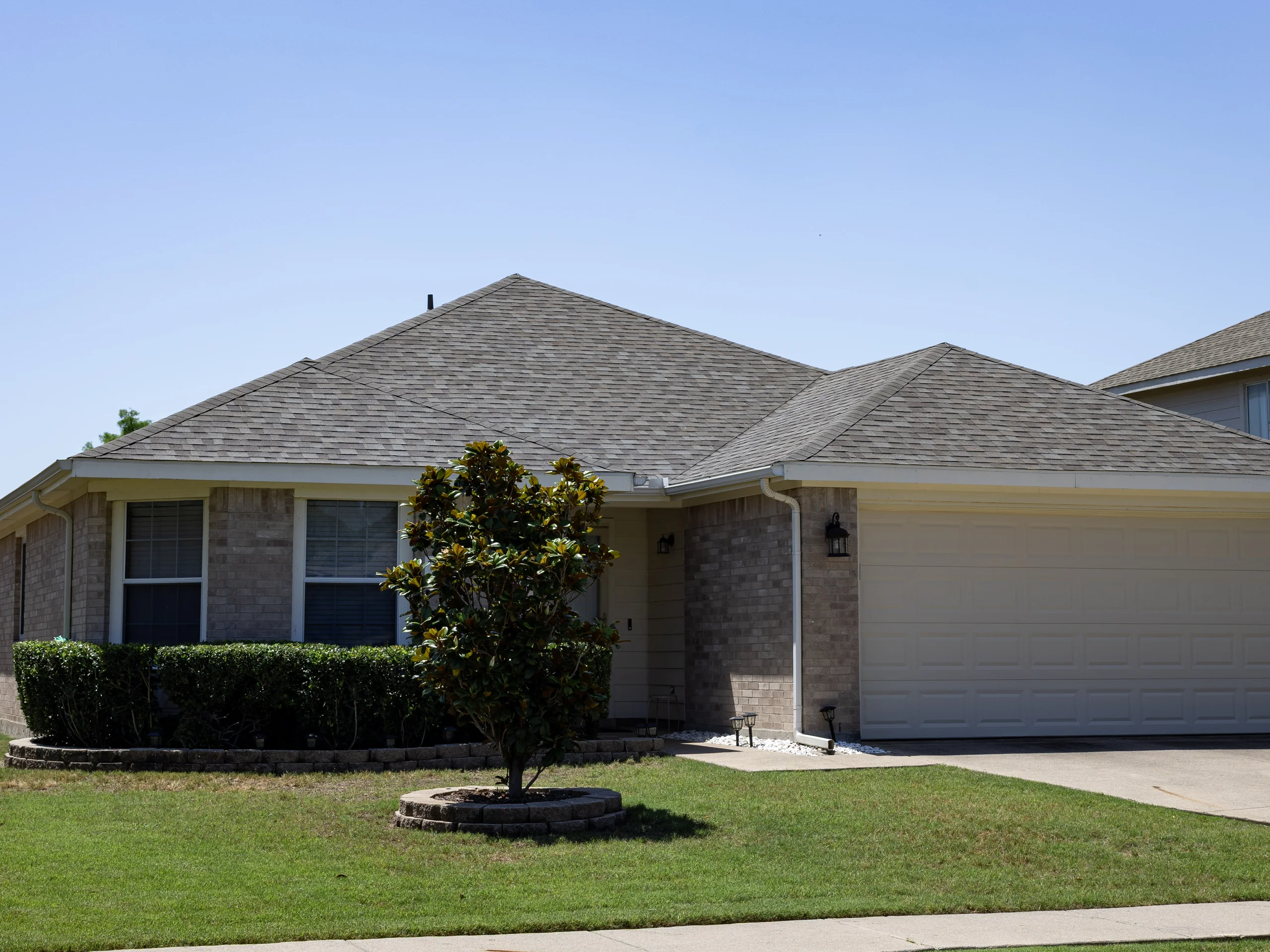 Completed asphalt-shingle roof on a North Texas home