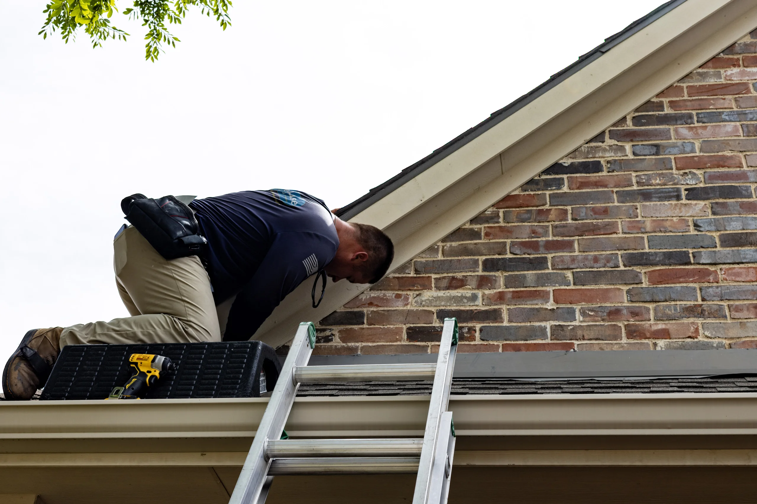 Firehouse Roofing inspection of a home's gutter and roofline