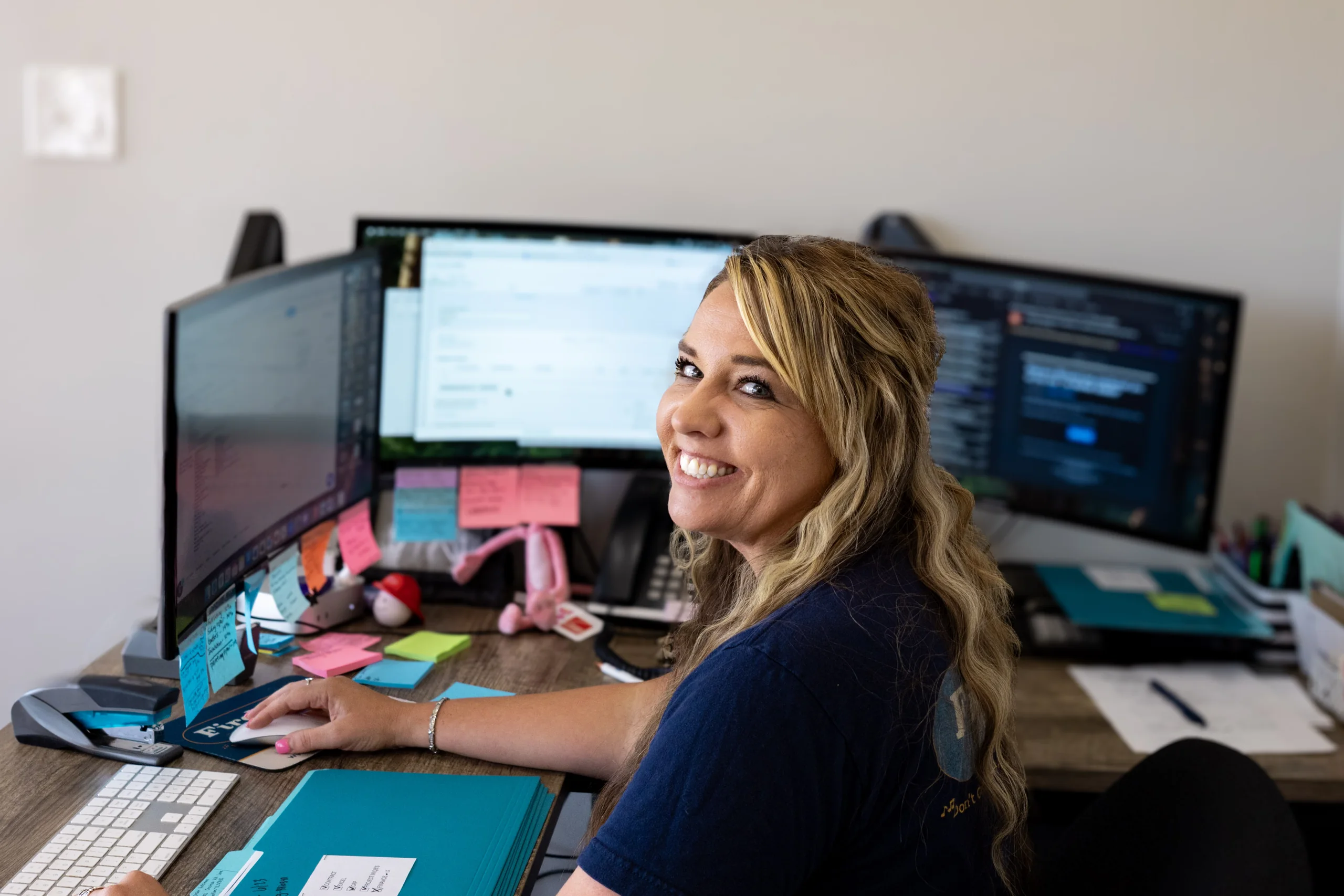 Firehouse Roofing Office Team Member Working at Her Desk Firehouse Roofing office team member working at her desk