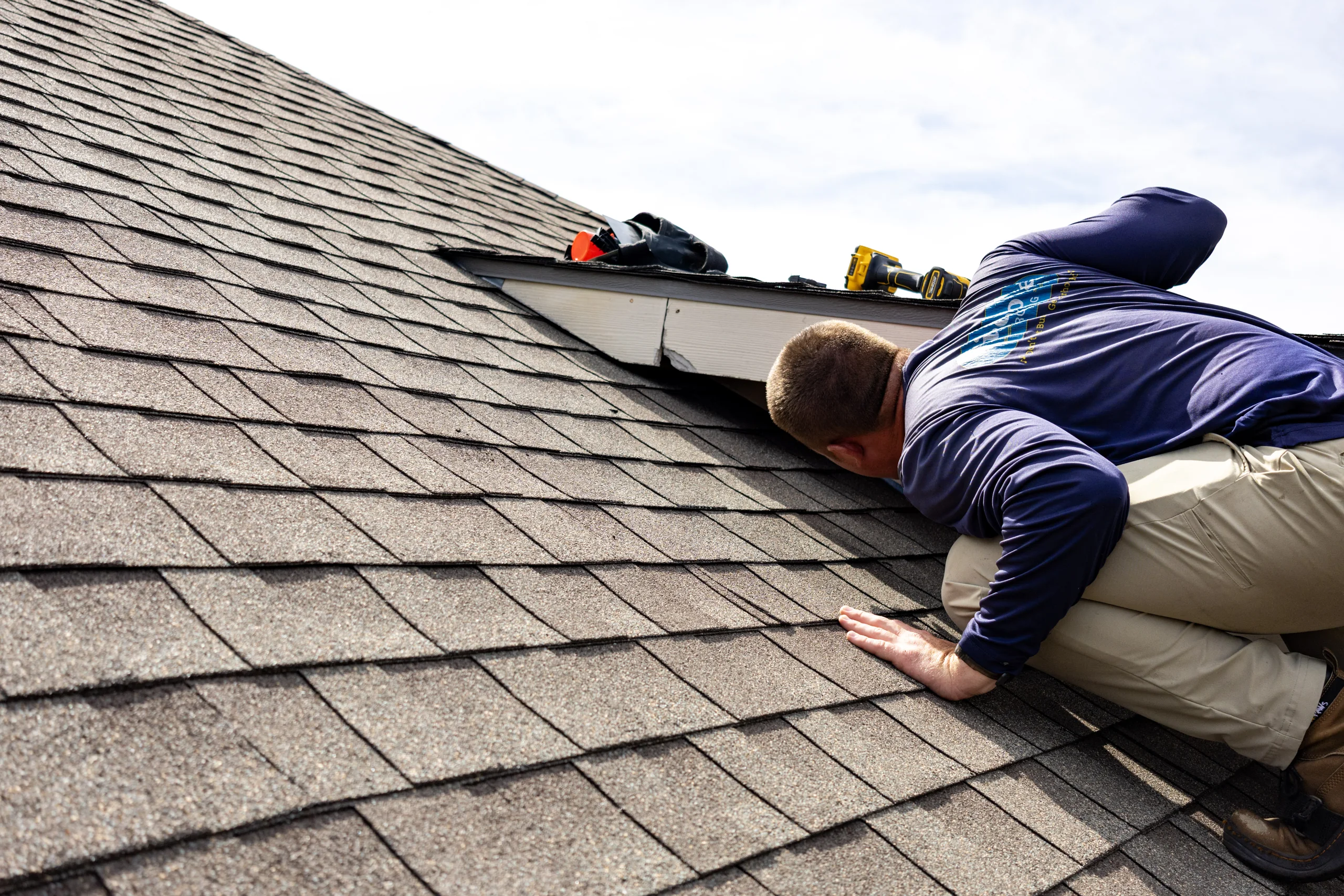 Firehouse Roofing professional inspecting residential roof flashing