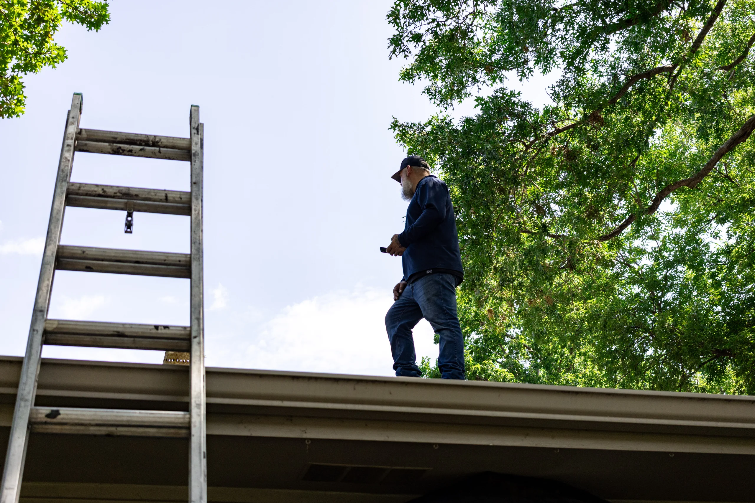 Firehouse Roofing professional inspecting a residential roof