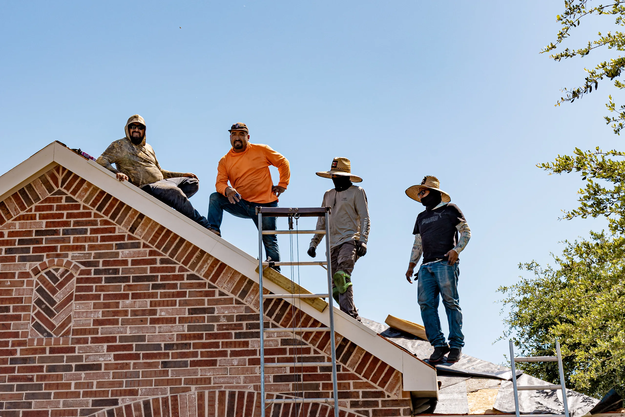 Roofing crew installing a new roof on a North Texas home