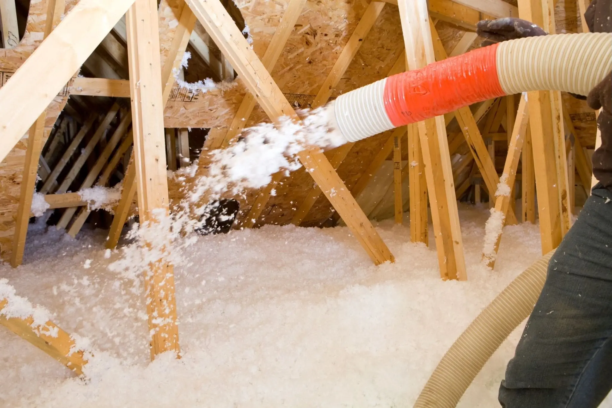 Blown-in attic insulation being installed
