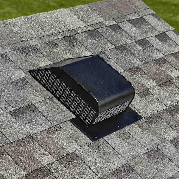 Solar attic fan mounted on a shingle roof